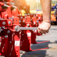 The mechanics repair combine harvester. Modern agricultural machinery